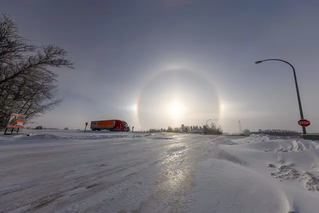 Sun halo over the highway intersection in winter